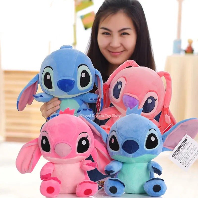 Person holding four colorful plush toys resembling cartoon characters.