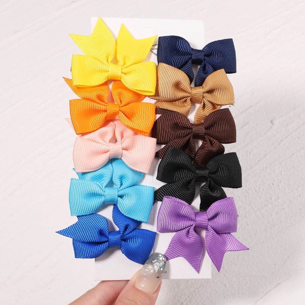 Assorted colorful hair bows on a white background