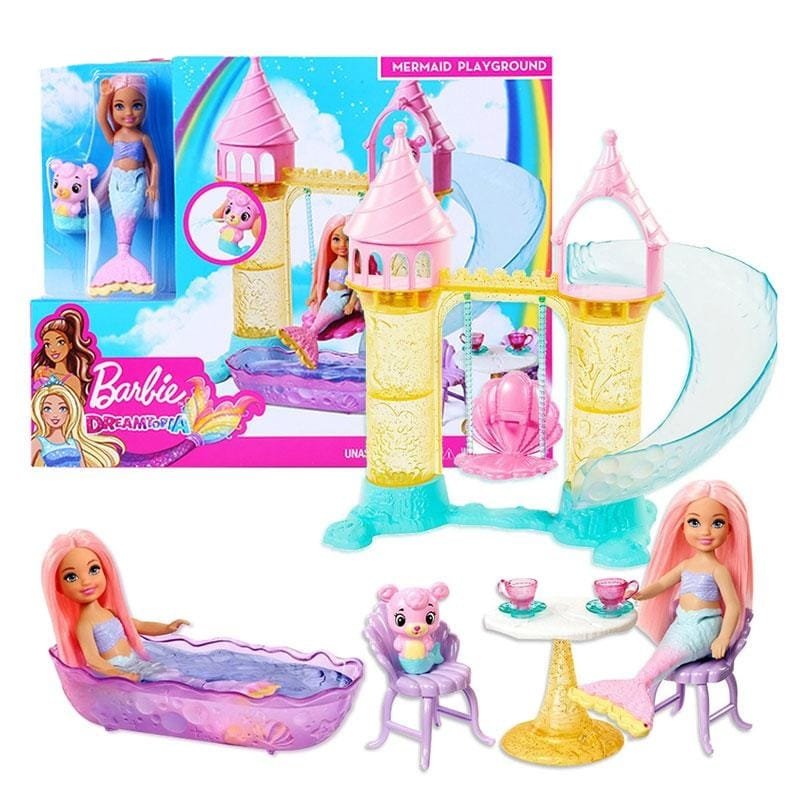 Barbie mermaid playground set with dolls and accessories in front of packaging