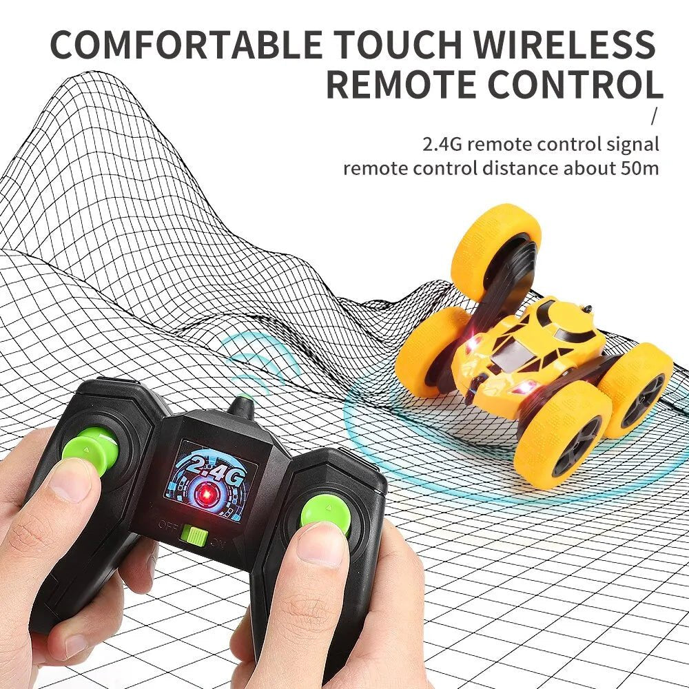 Hand holding a wireless remote control with a toy car on a grid background