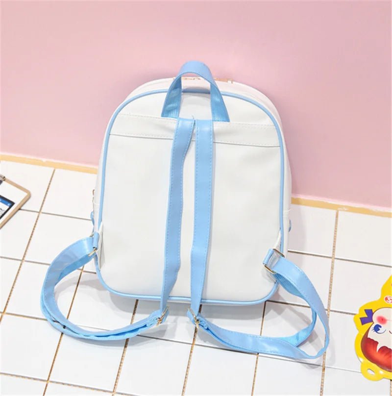 White backpack with blue straps on a tiled floor against a pink wall