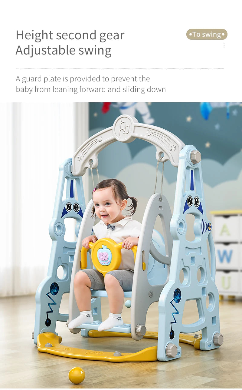 Child in a swing with a safety guard plate, indoor setting