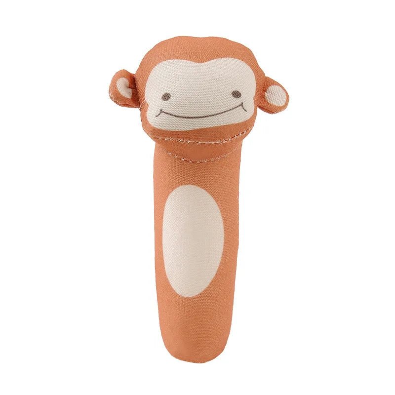 Plush monkey toy with a white face on a white background