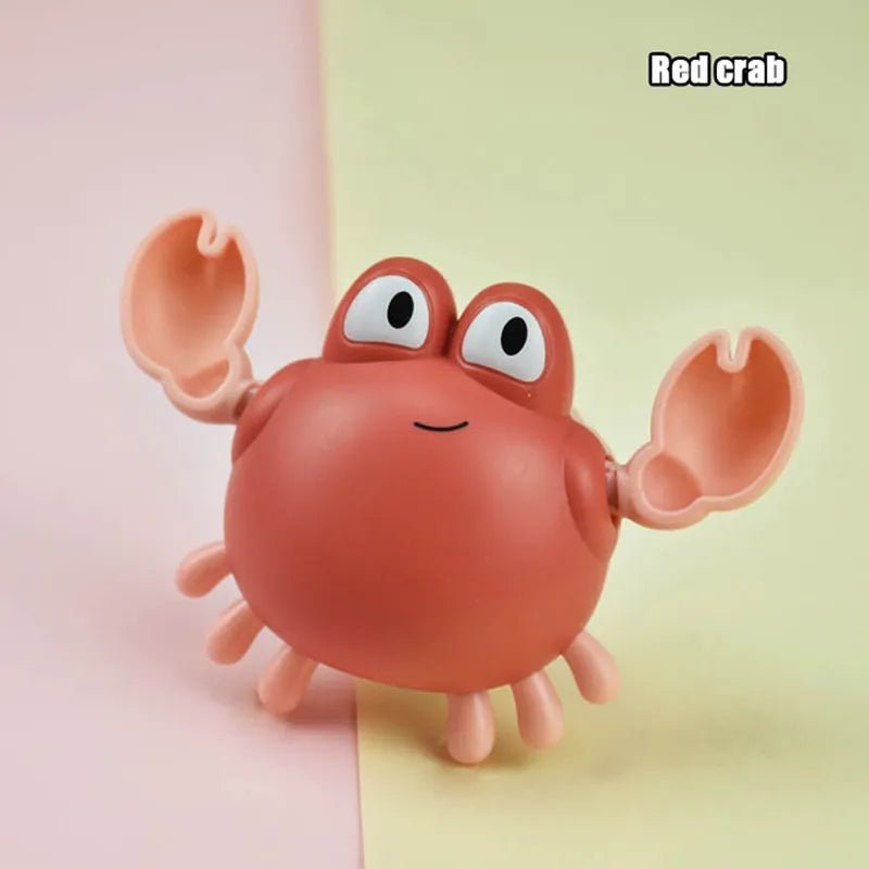Toy crab with a red body and pink legs on a two-tone pink and yellow background.
