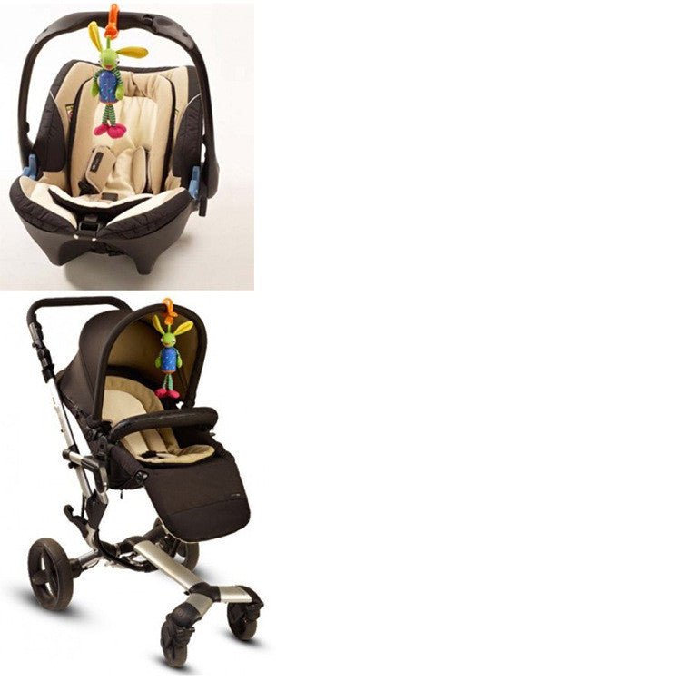 Baby car seat with attached toy and stroller on a white background
