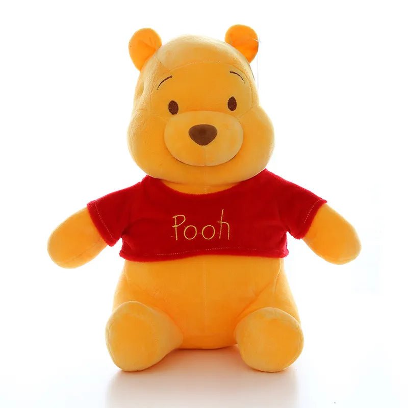 Plush toy bear wearing a red shirt with 'Pooh' on a white background