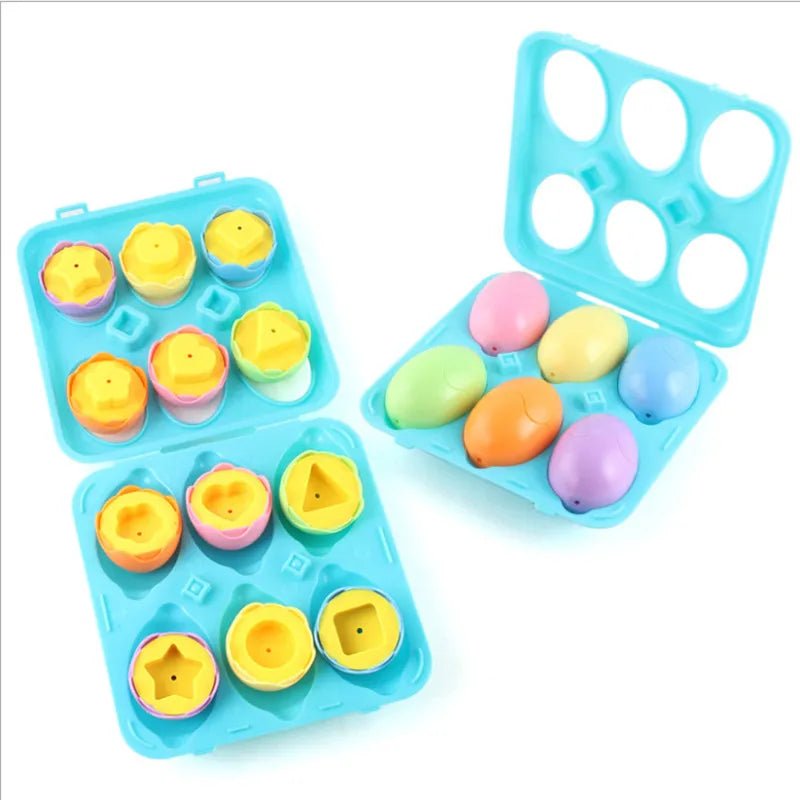 Colorful plastic ducks and eggs in blue trays on a white background