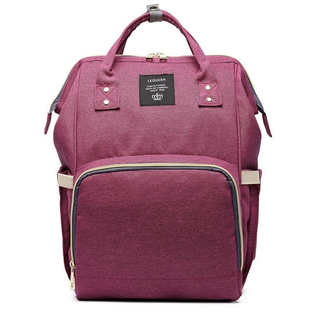 Purple backpack with visible brand logo on a white background
