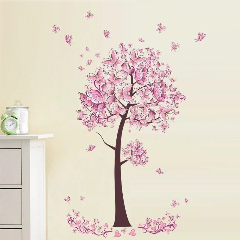 Wall decal of a pink tree with flowers on a beige wall.