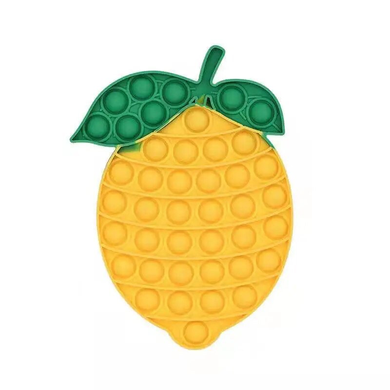 Yellow lemon-shaped pop-it toy with green leaf on a white background