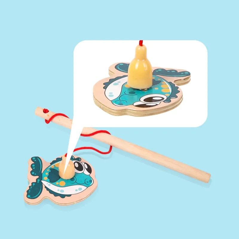 Wooden fishing game with whale-shaped reels and fishing rod on a light blue background