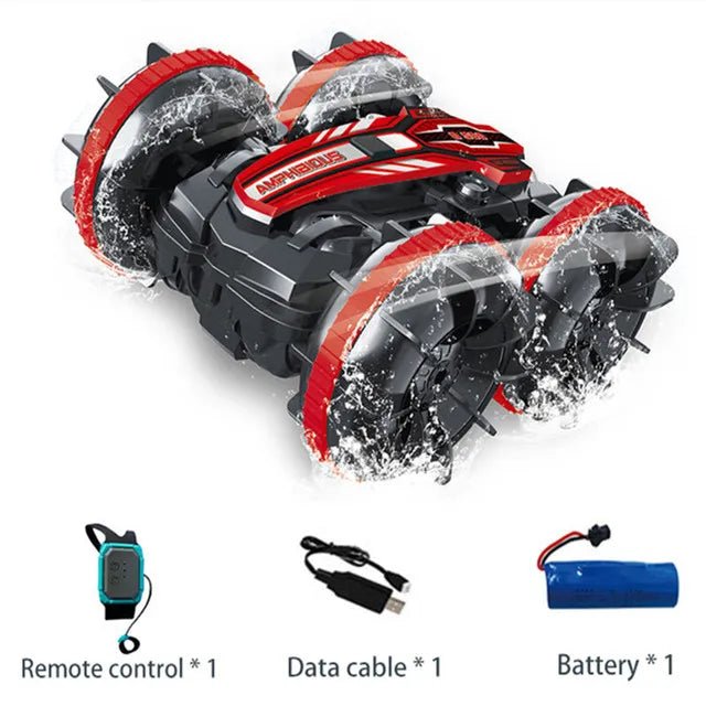 Toy snow blower with remote control, data cable, and battery.