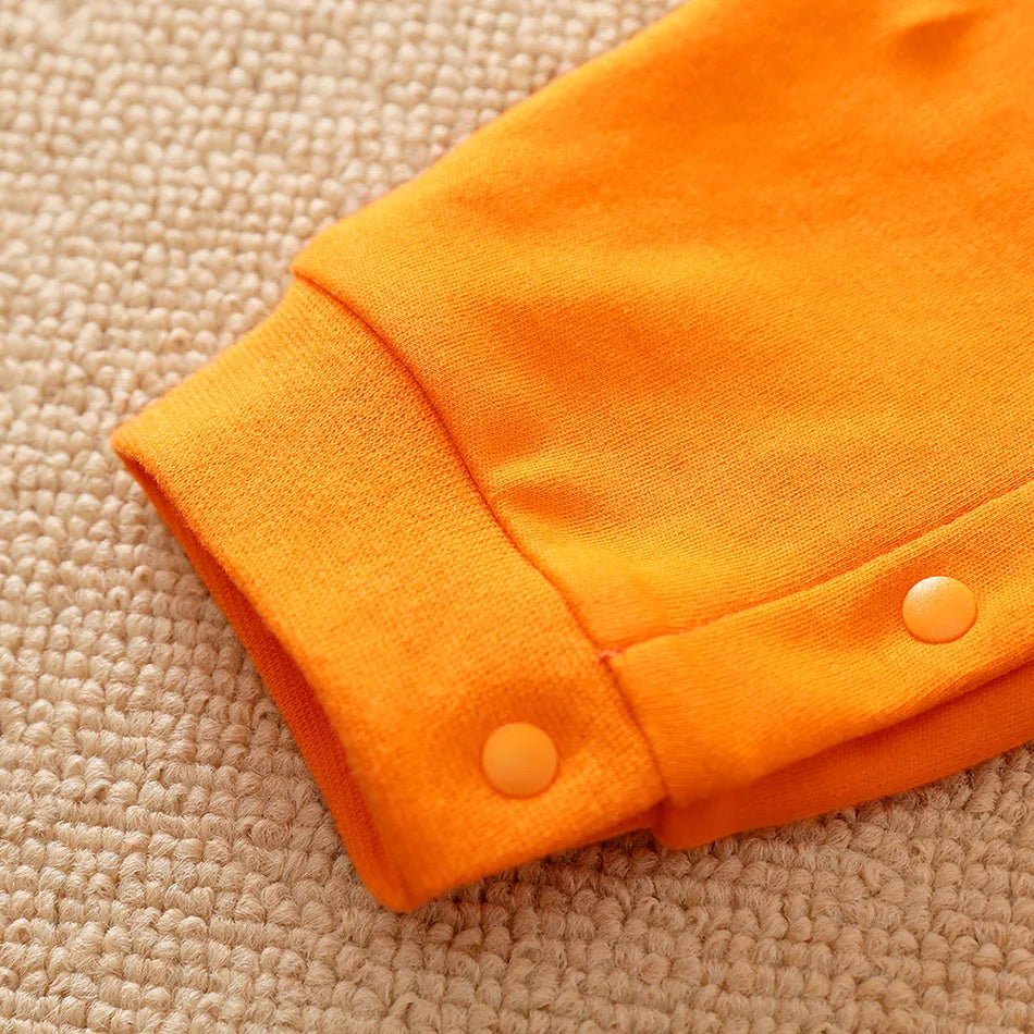 Close-up of an orange garment with buttons