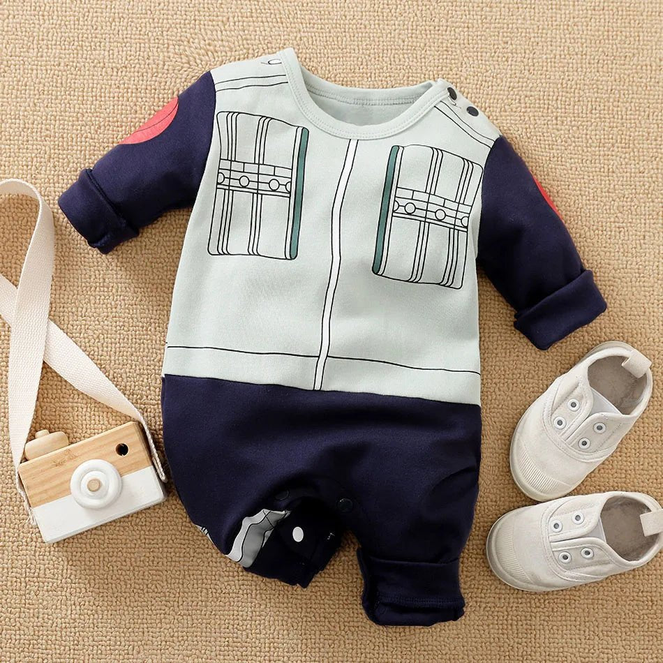 Baby outfit with navy and white design, shoes, and toy camera