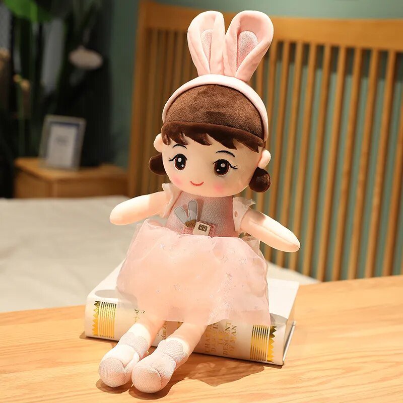 Plush toy with bunny ears on a wooden table