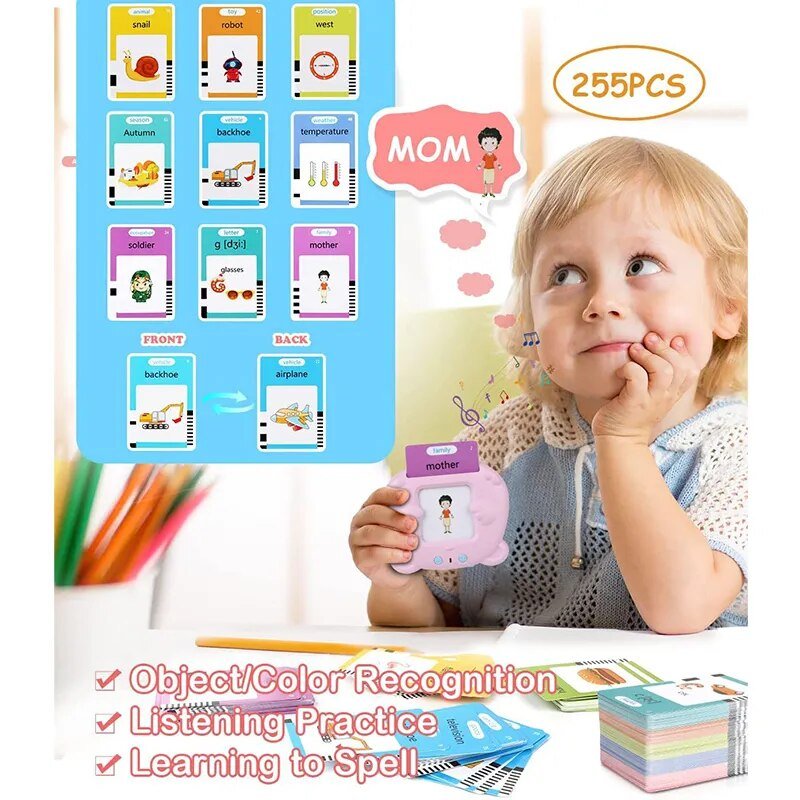 Child holding a flashcard with 'MOM' and educational cards on a table.