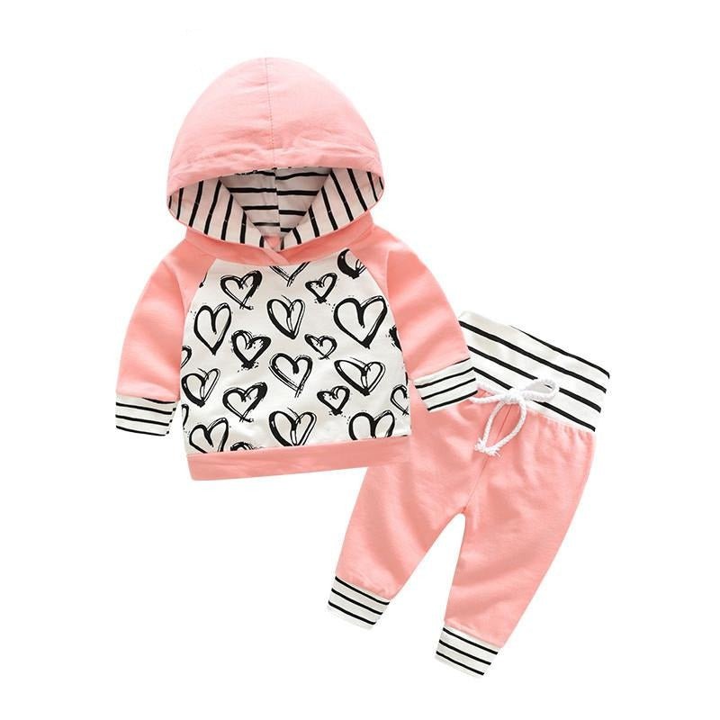 Children's pink hoodie and pants set with heart patterns