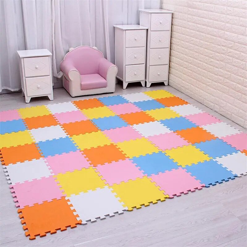 Colorful foam puzzle mat in a room with children's furniture.