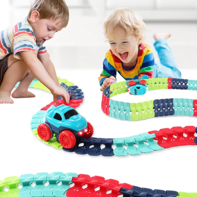 Children playing with a colorful toy train track set.