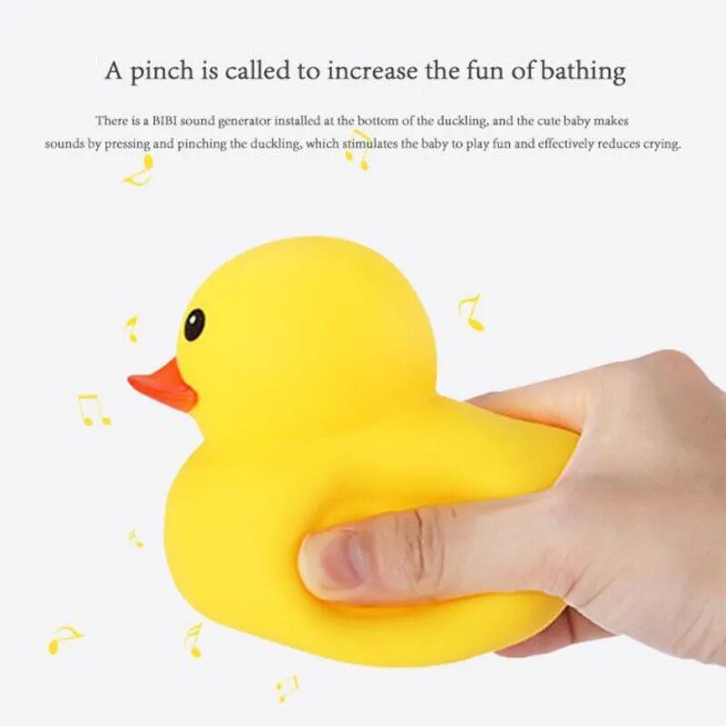Yellow rubber duck being squeezed by a hand.