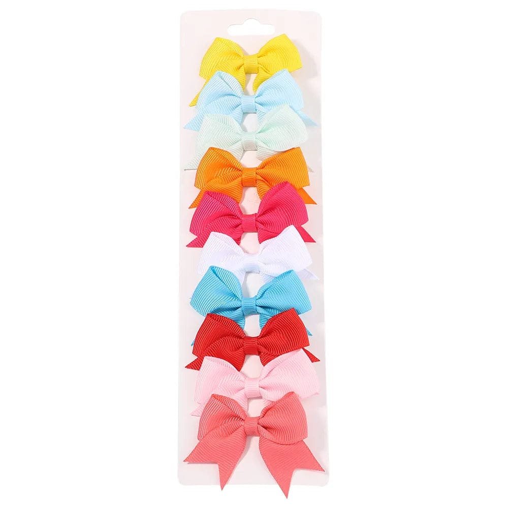 Set of colorful hair bows on a white background