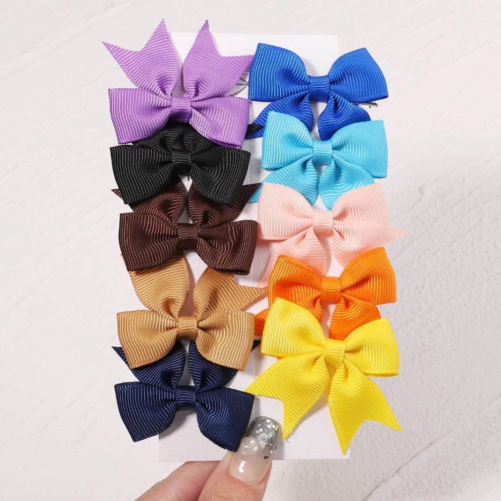 Assorted colorful hair bows on a white background