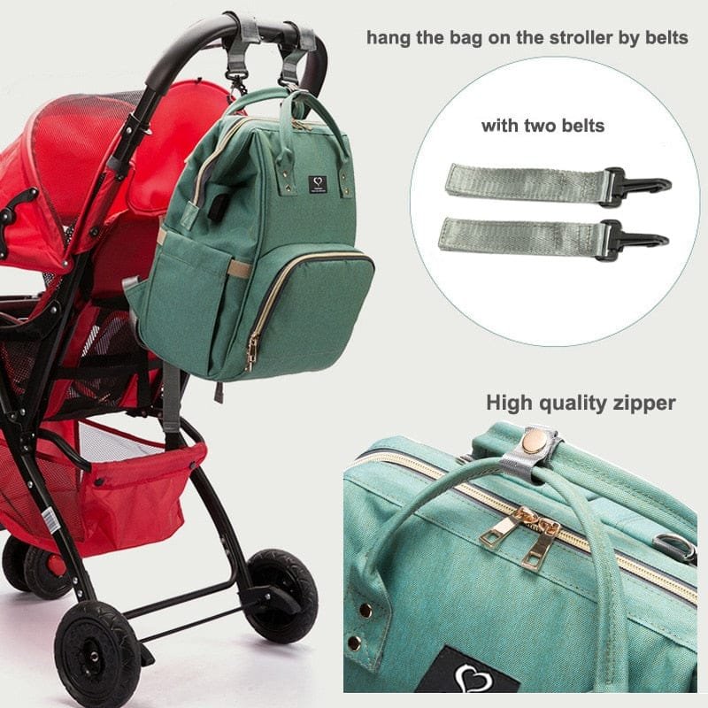 Green backpack with straps attached to a red stroller, showing high-quality zipper and detailed strap attachment.
