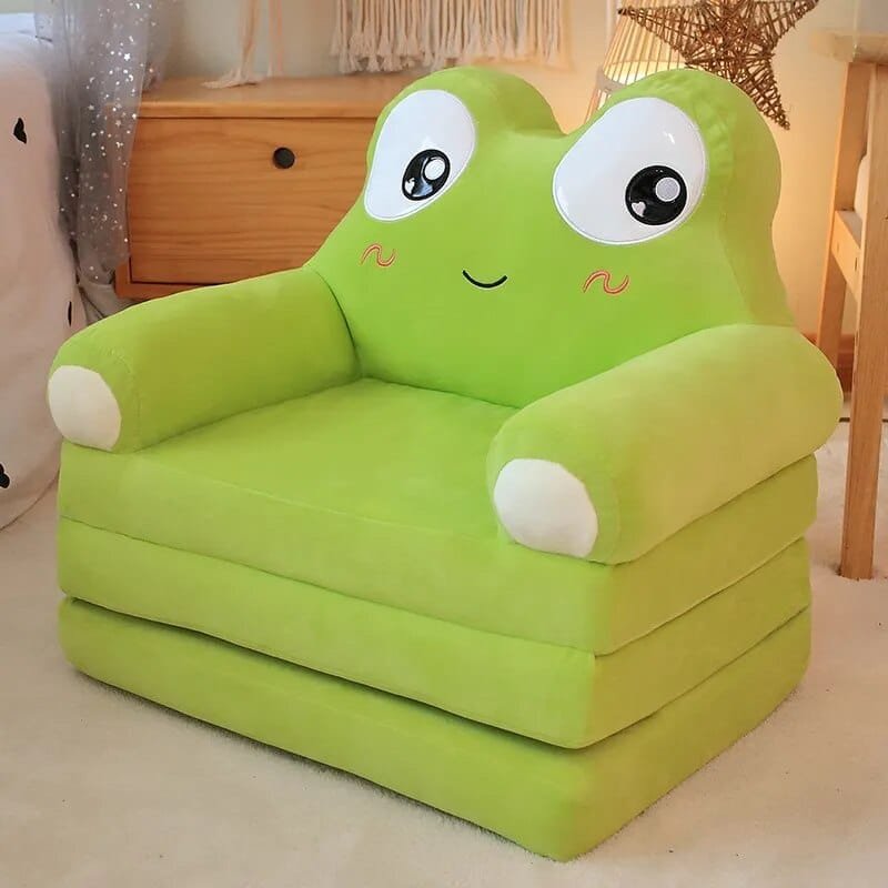 Green inflatable chair with a cartoon face on a light-colored floor.
