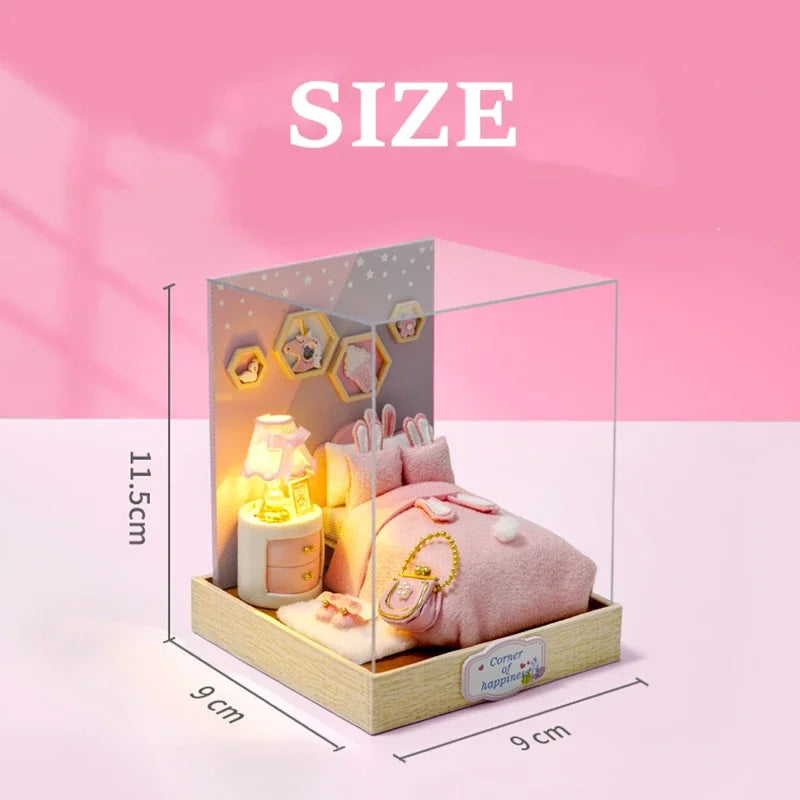 Pink plush toy and lamp set in a clear box with dimensions on a pink background