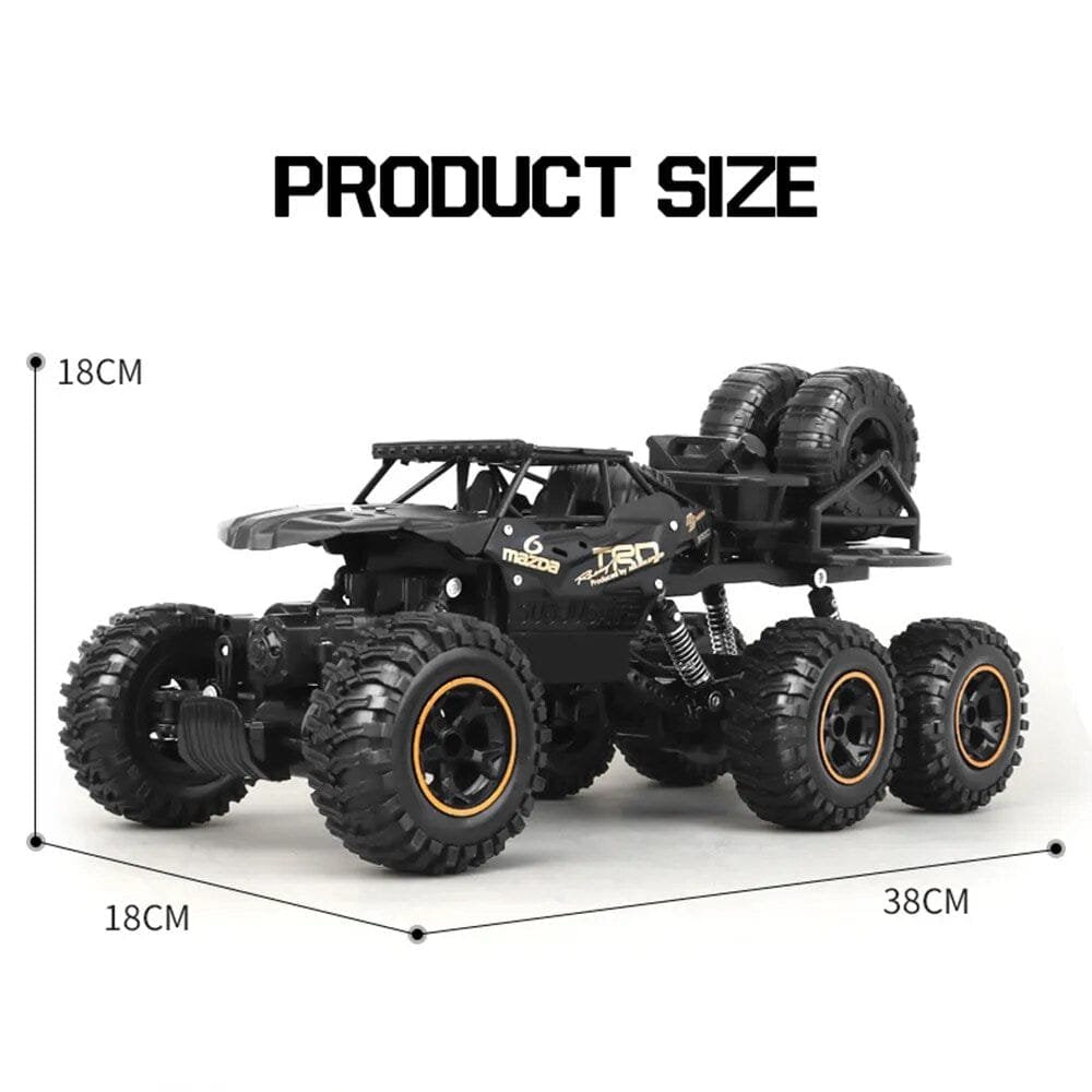 Black off-road toy truck with measurements.
