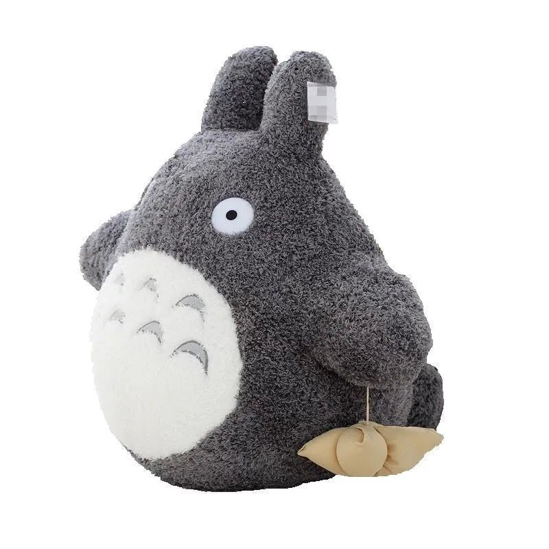 Plush toy resembling a character with a gray body and white face on a white background