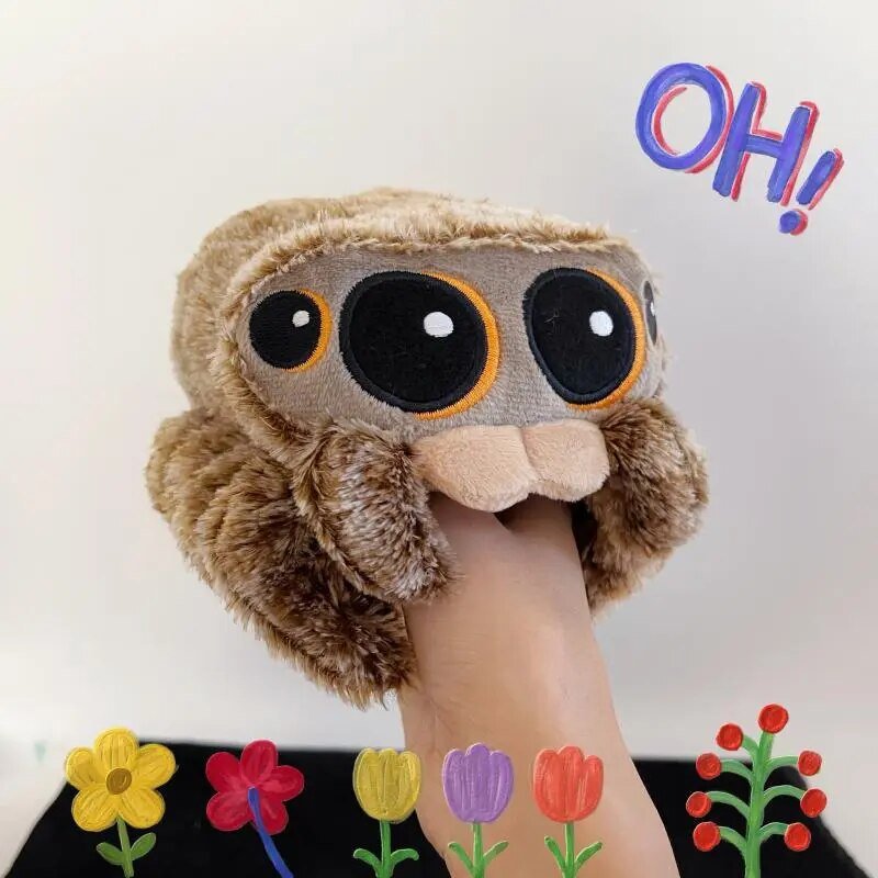Plush toy resembling a sloth with a surprised expression, held by a hand
