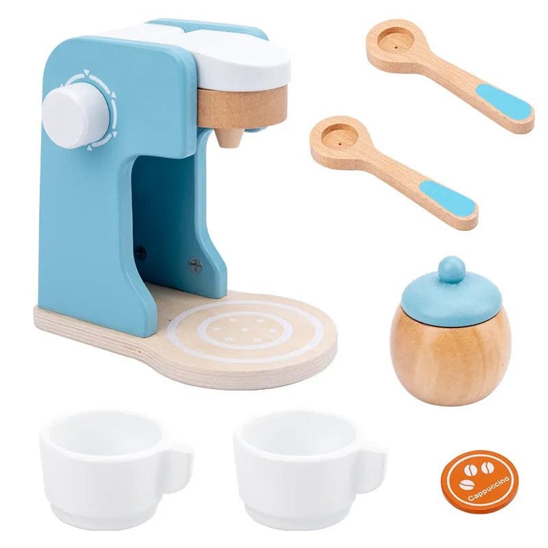 Children's toy coffee set featuring a blue espresso machine, white cups, wooden spoons, and a sugar bowl.