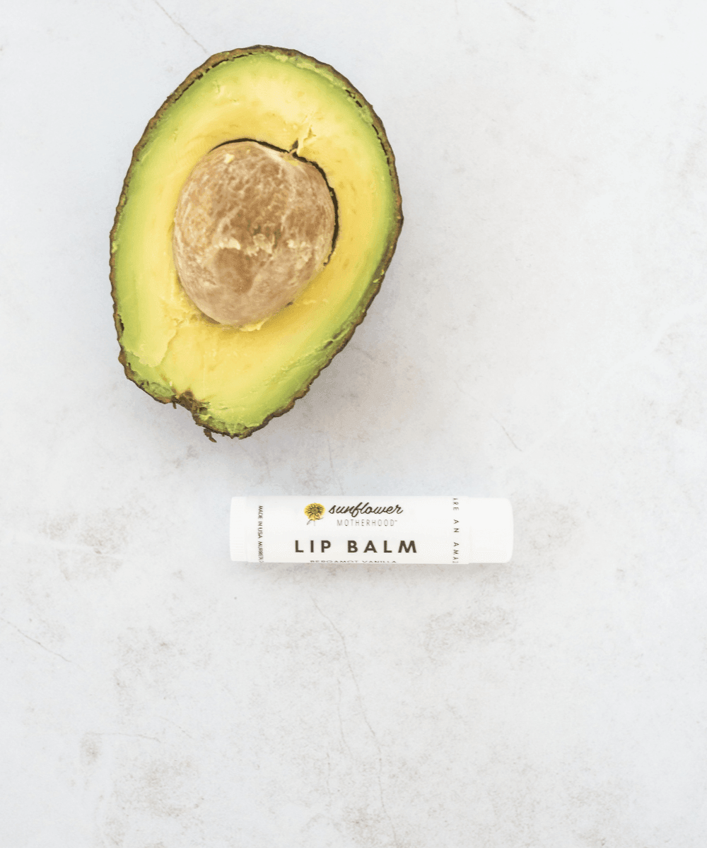 Half-cut avocado and a lip balm.