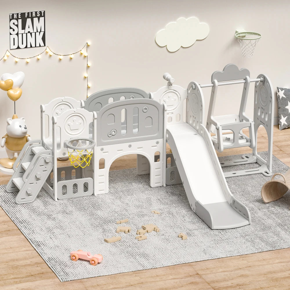 Children's playset with slide and basketball hoop on a wooden floor.