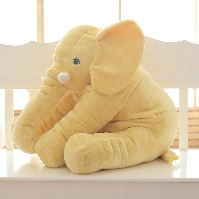 Yellow plush elephant toy in sitting position.
