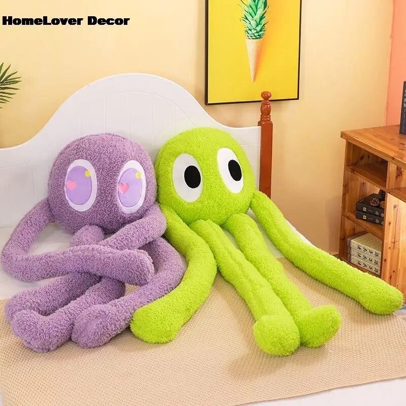 Two plush octopus toys, one purple and one green, sitting on a couch with a 'HomeLover Decor' label.