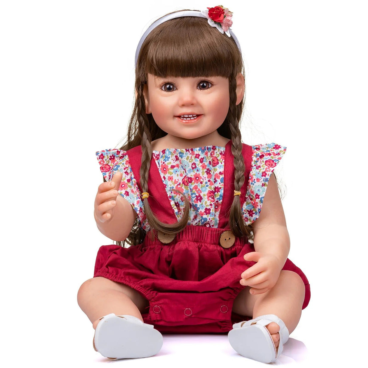 Doll with braided hair wearing a floral top and red dress
