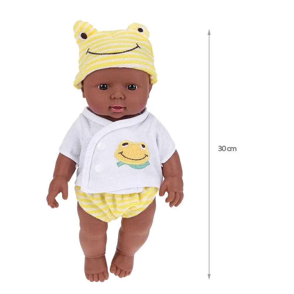 Baby doll with yellow frog-themed outfit and hat.