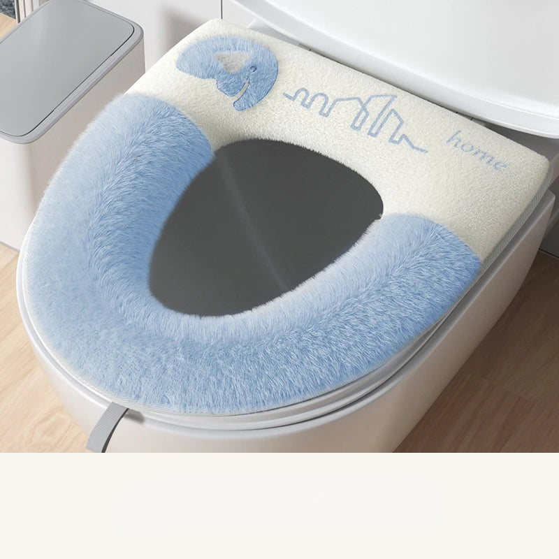 Blue and white toilet seat cover on a toilet