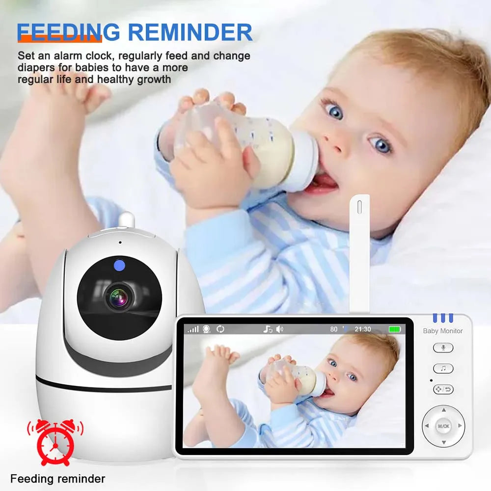 Baby holding a bottle with a feeding reminder system in the foreground