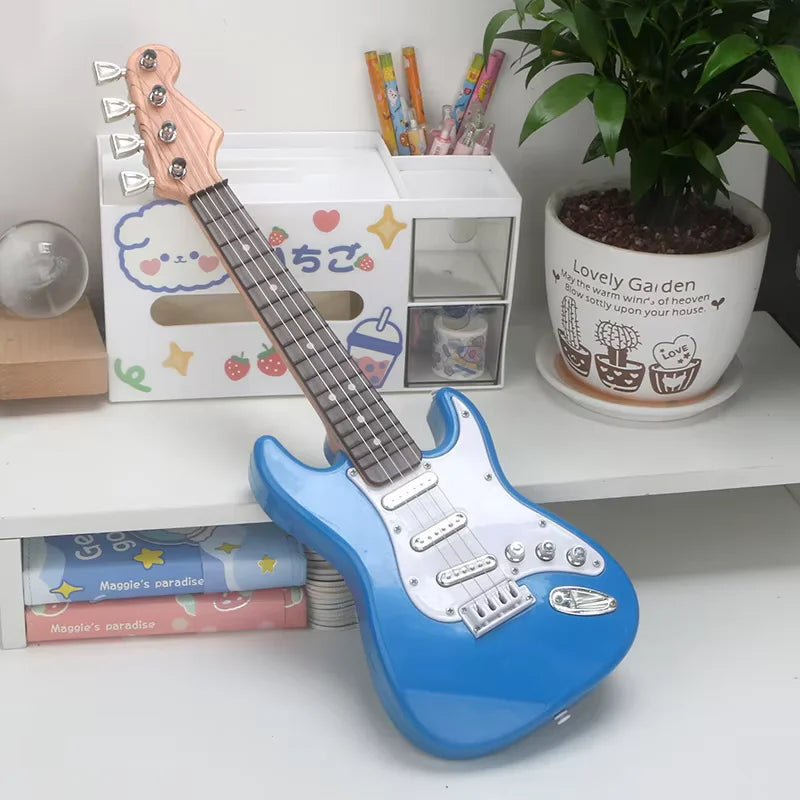 Blue electric guitar on a shelf with stationery items and a plant in the background