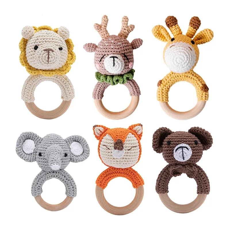 Set of six animal-themed teething rings on a white background