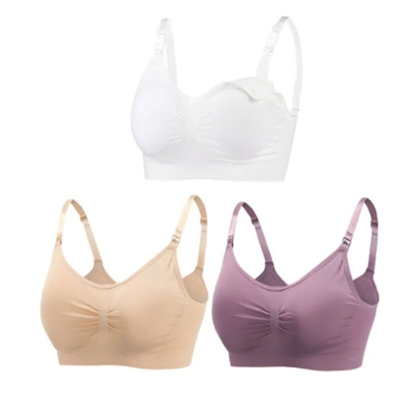 Set of three bras in white, beige, and purple on a white background
