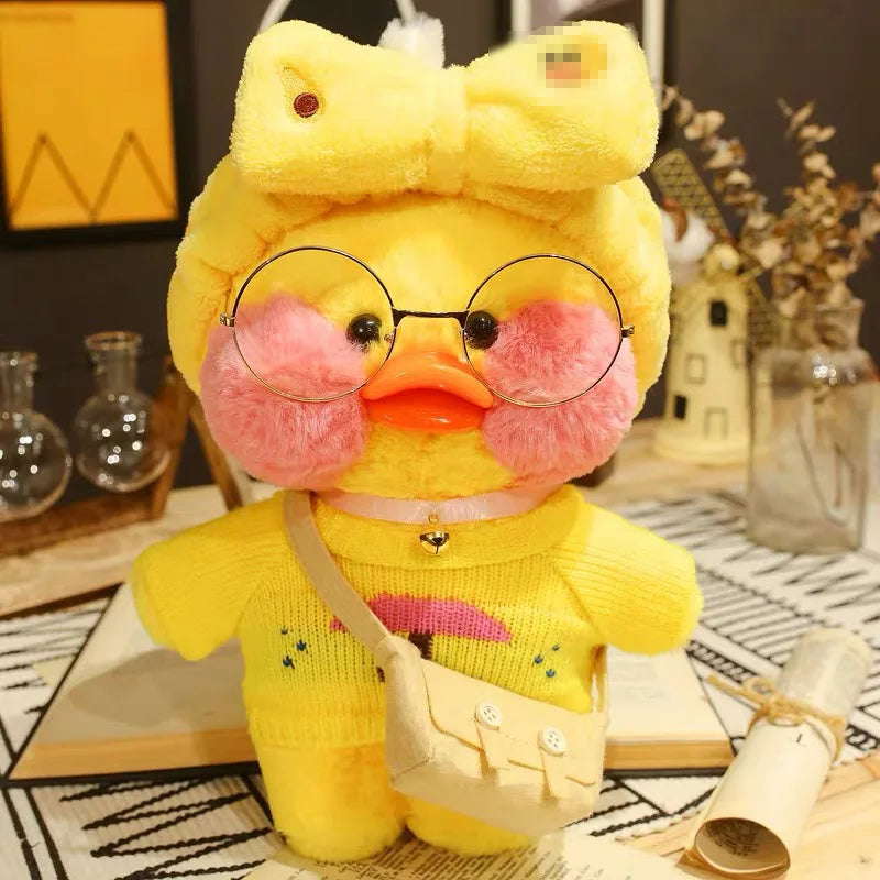 Yellow plush toy with glasses and a bow tie on a decorative surface