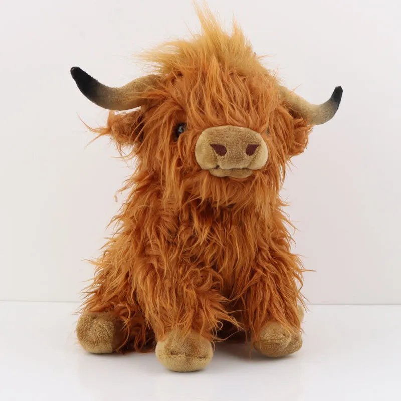 Plush toy of a fluffy brown Highland cow.