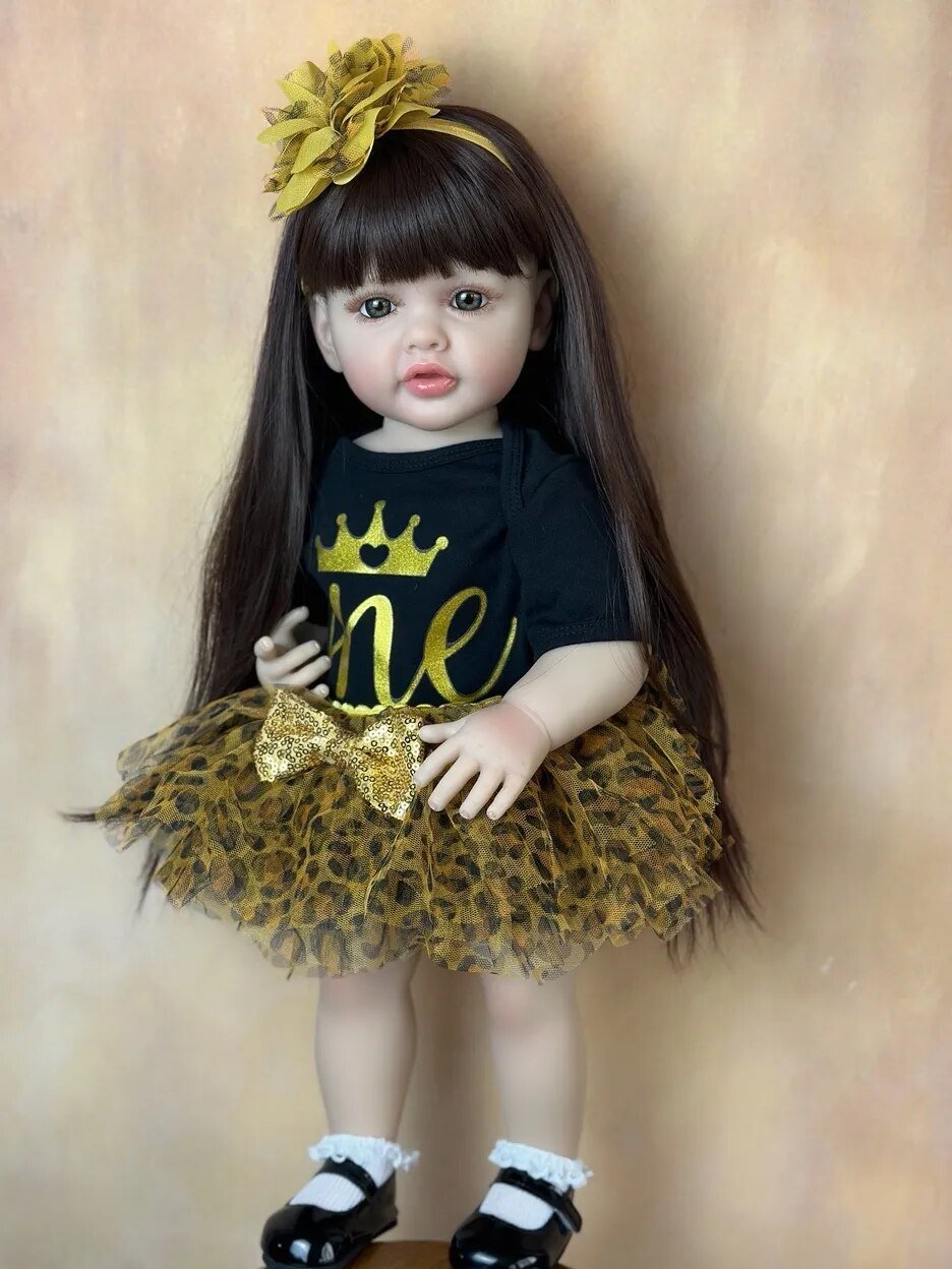 Doll with long dark hair, wearing a black shirt with gold lettering and a leopard print skirt
