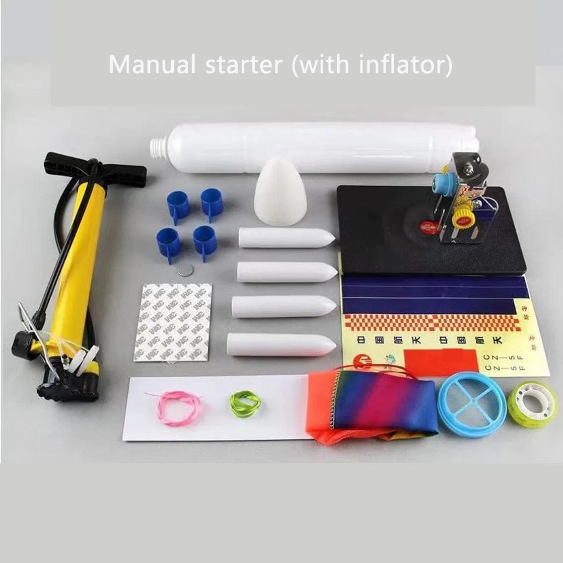 Collection of items including a manual starter with an inflator, pump, and various small objects.