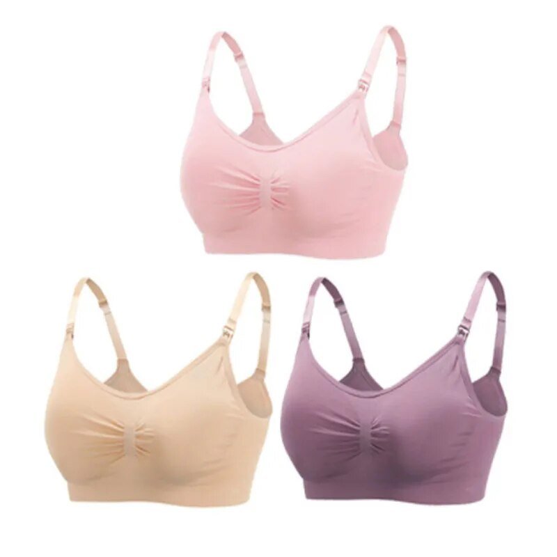 Three wireless bras in pink, beige, and purple on a white background
