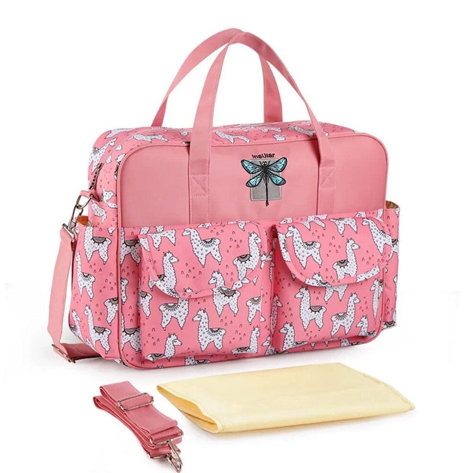 Pink diaper bag with animal print and accessories